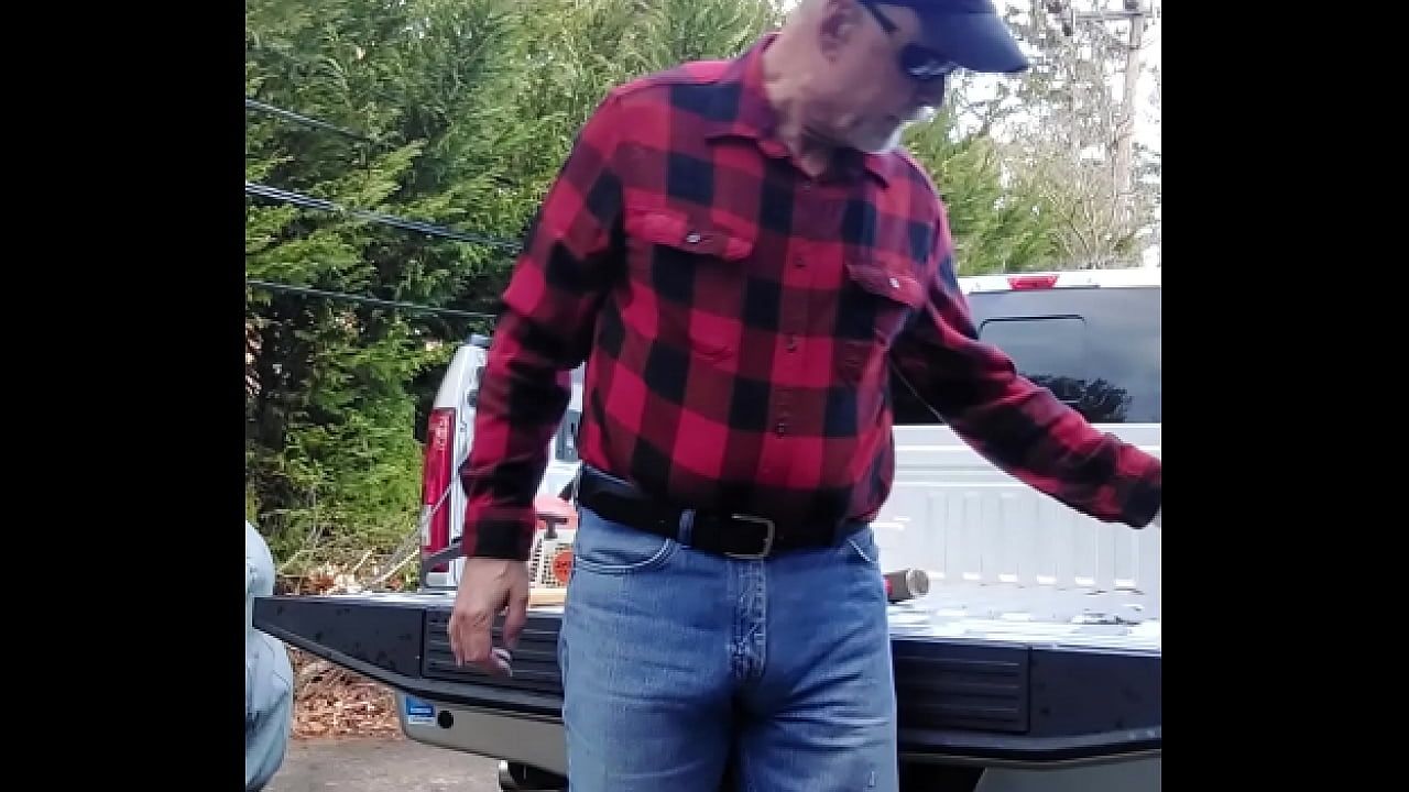 Lumberjack type guy finishes up after cutting wood