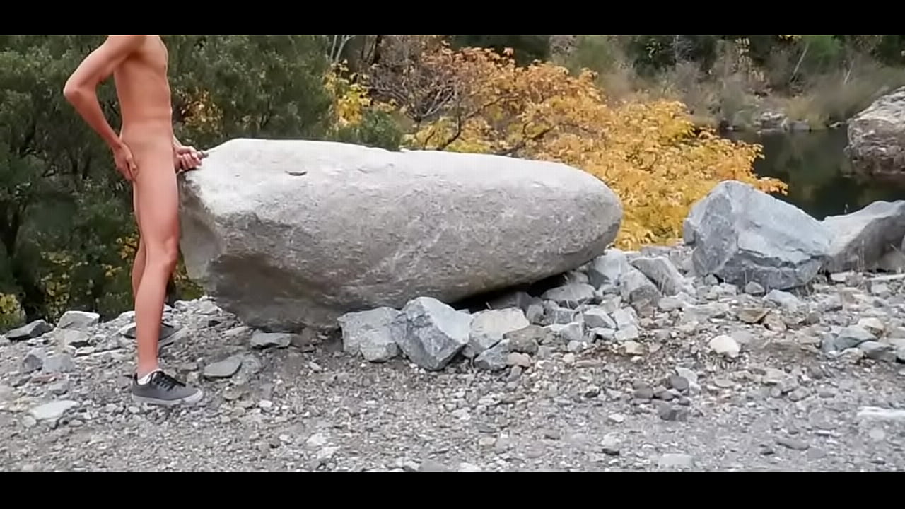 My cock jerking off against a large rock