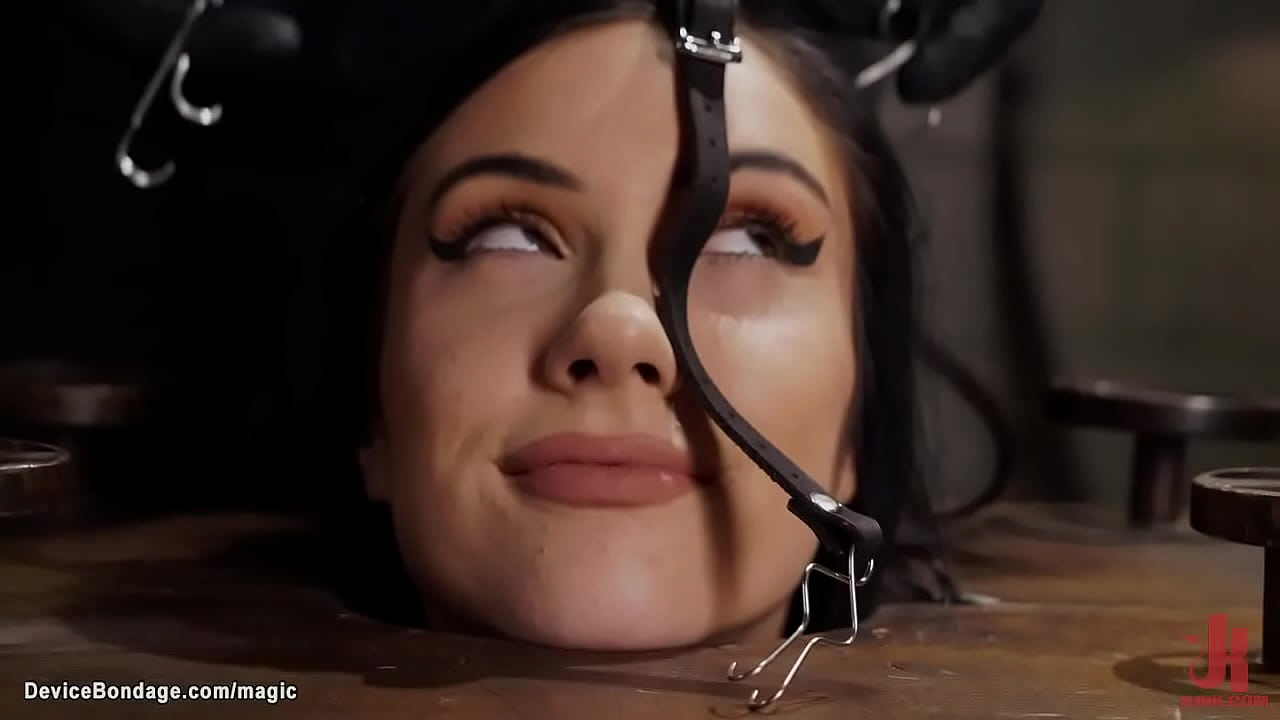 Tied and locked in bondage cube sexy skinny brunette babe Jazmin Luv gets gagged then bent over caned and fucked with dick on a stick by master The Pope