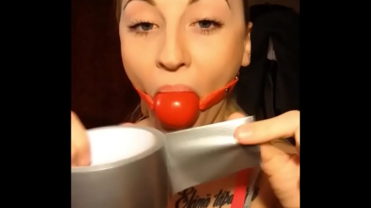 Blonde Slut Gagging Herself With Ballgag And Tapegag