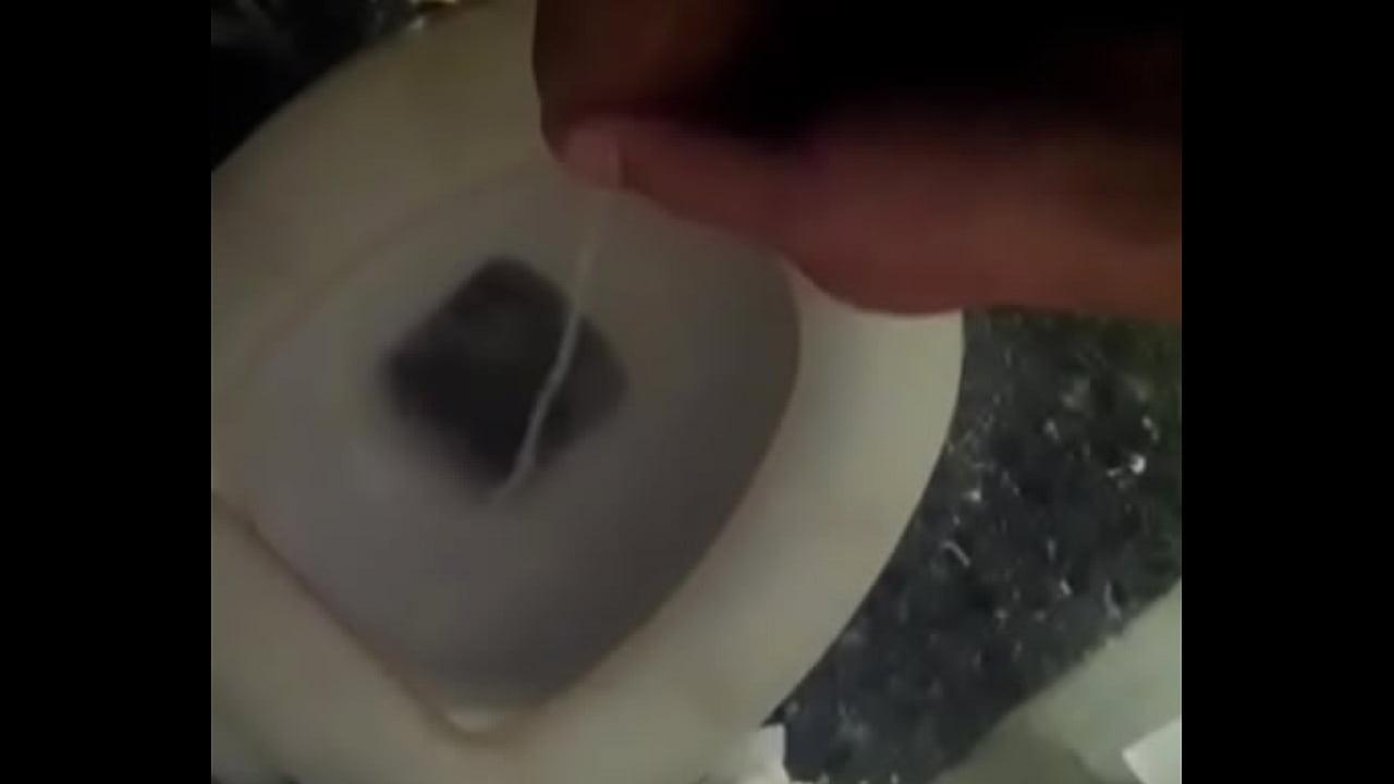 Solo white pissing in toilet