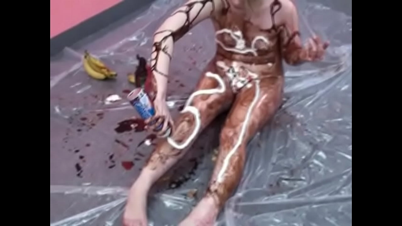 Veronica Snow gets covered in ketchup and poses for the camera on the floor