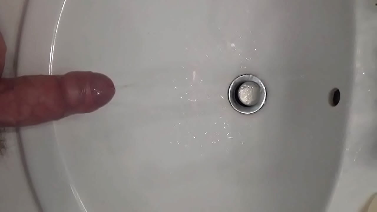 Peeing with hard cock