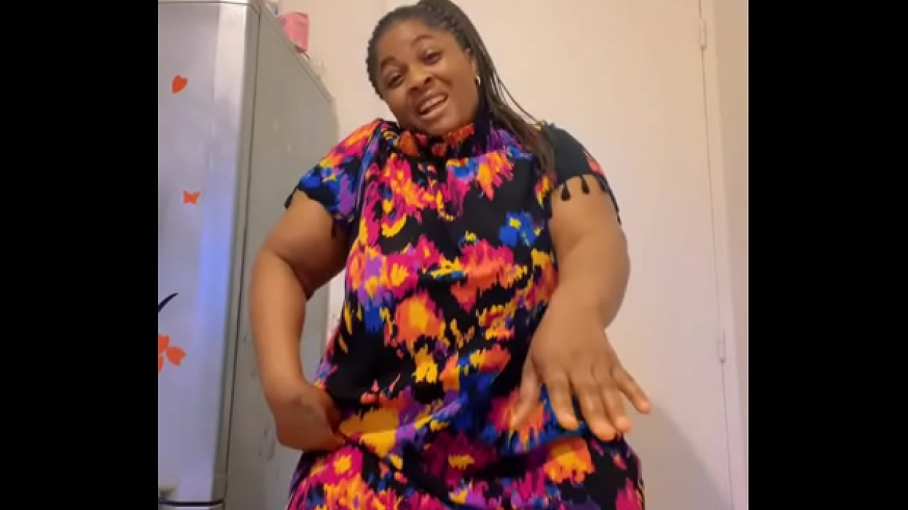 Afro Getty showing thighs while dancing in flower dress