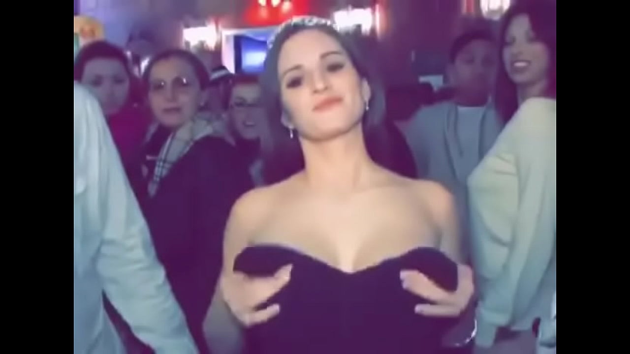 Cute busty girl in dress flashes boobs