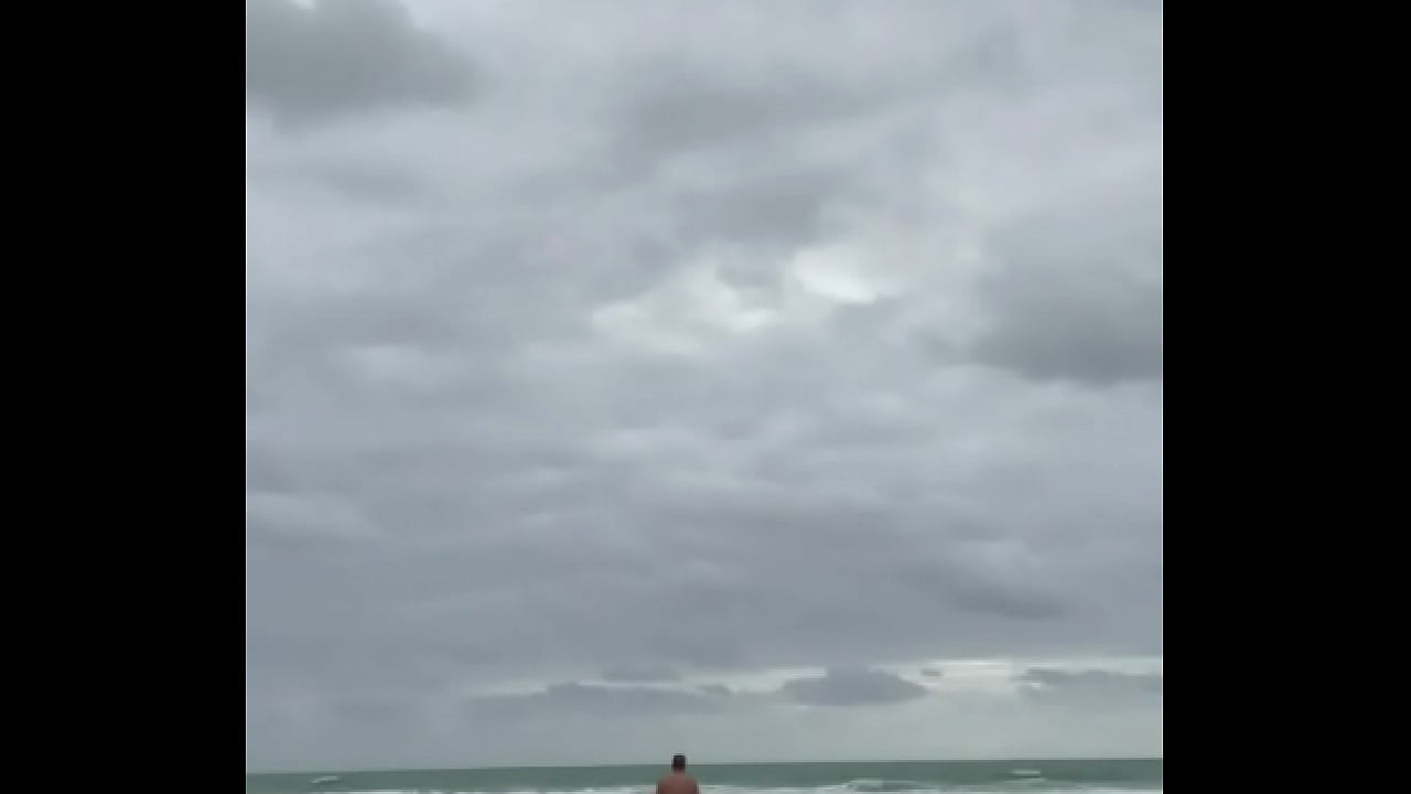 Showing off nude on the beach