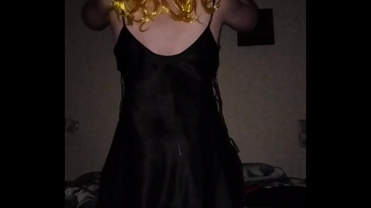 Sissy crossdresser shakes ass in black dress