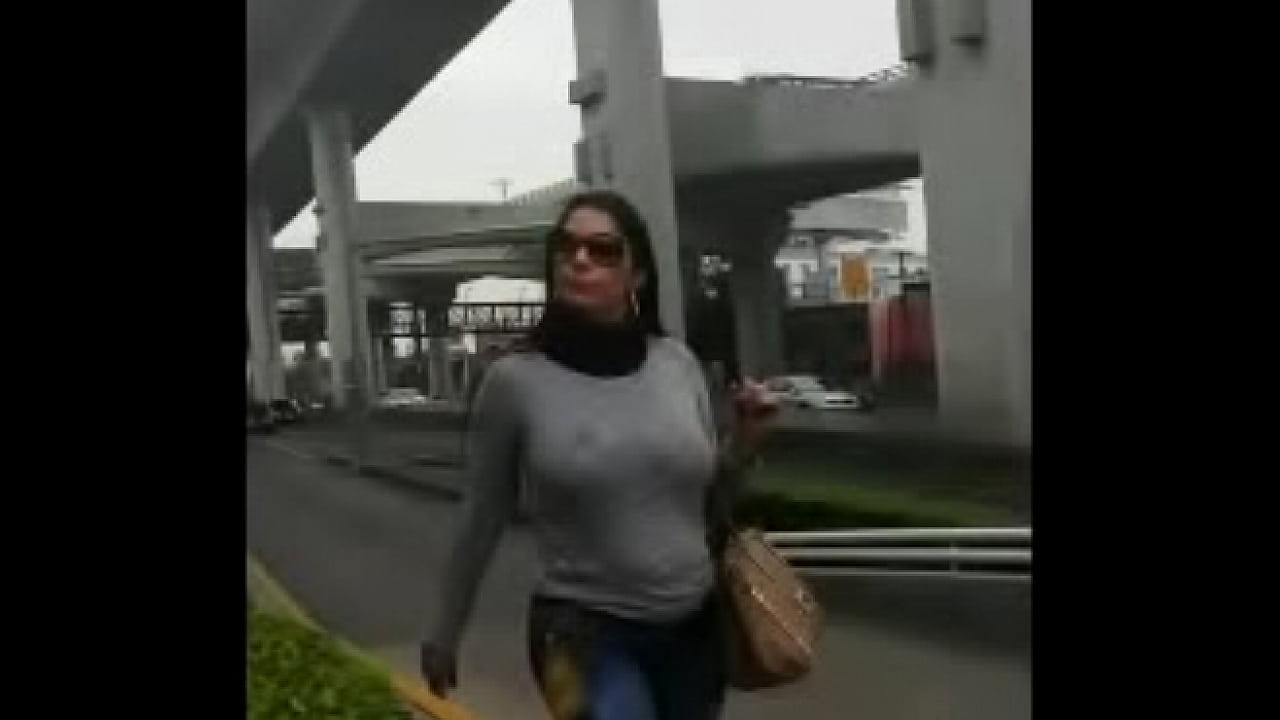 Busty latina walking on the street bouncing her huge boobs