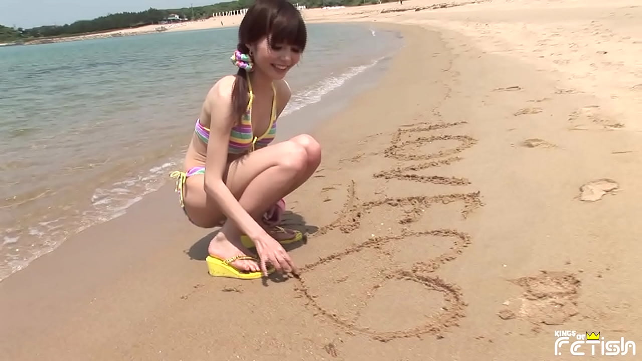 Young Japanese girl with small tits have a photo session outdoor by the sea