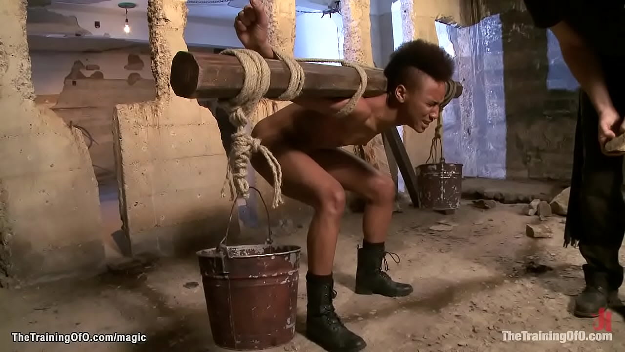 Small tittied ebony slave trainee Nikki Darling is loaded with weights and made do squats then suck big cock to shackled gimp Seth Storm under training of James Mogul