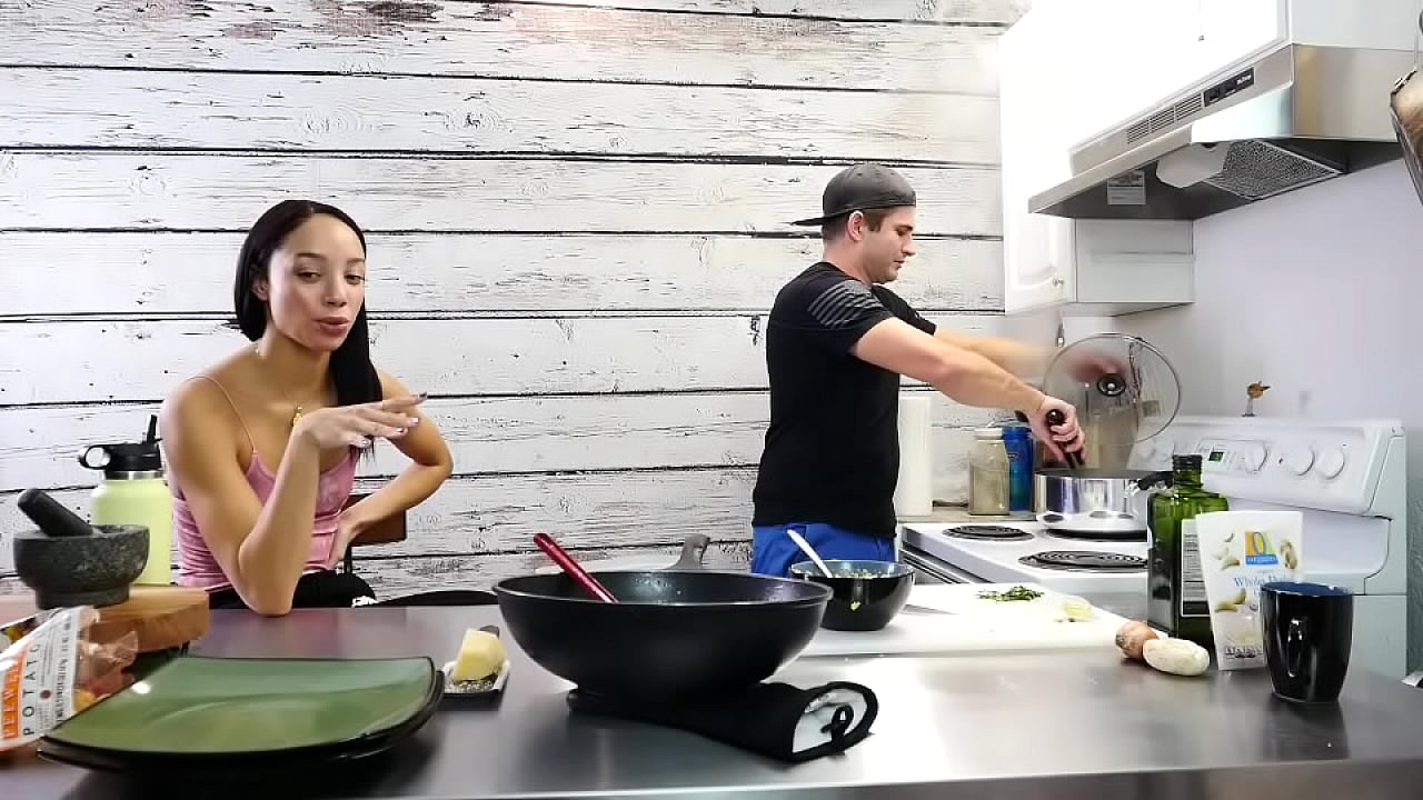 "Cooking delicious carbonara and garlic bread"