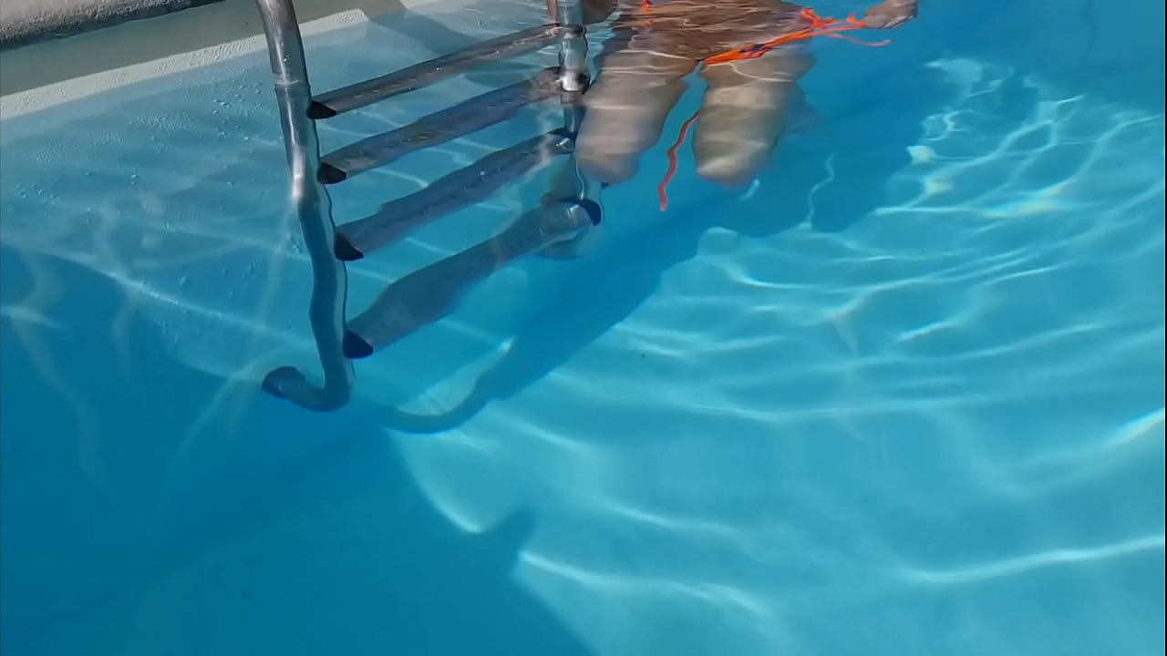 Beautiful student fingers her pussy in the pool.