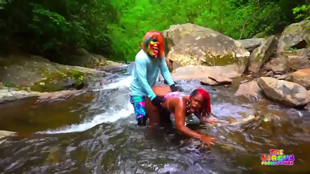 Clown fucks two ebony girls in a tropical forest with no remorse