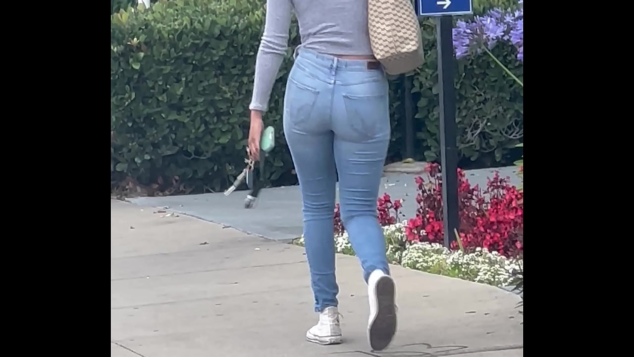 Young girl in jeans walking