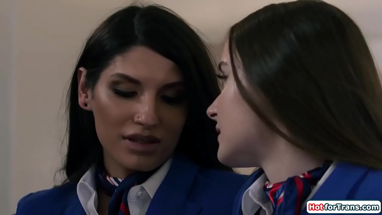 Shemale flight attendant Zariah Aura and her female colleague Hazel Moore are finally alone.The busty babe kisses and deepthroats the tgirls big cock