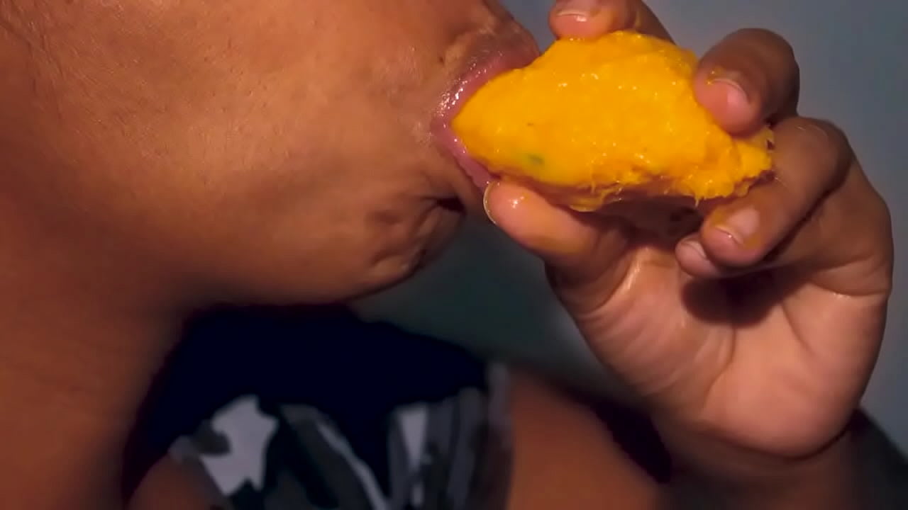 Lustful latina eating a mango the sexy way