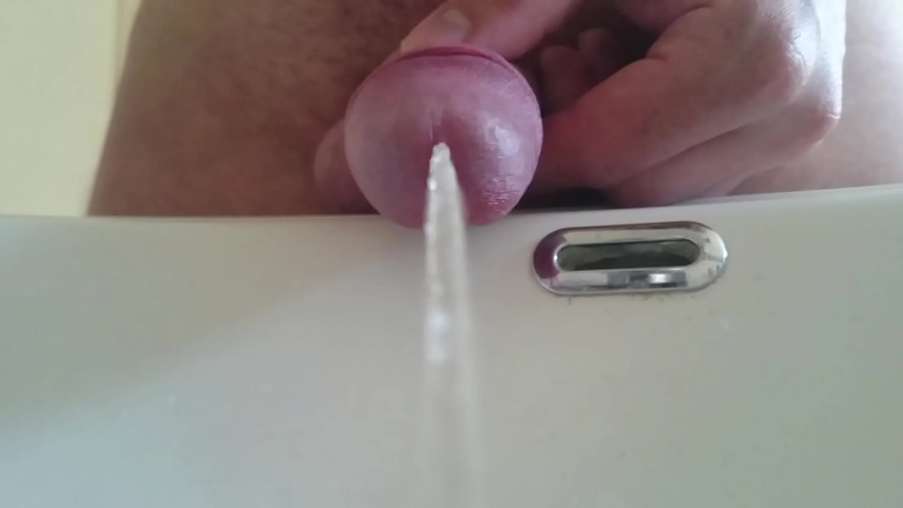 pissing in the sink with closeup