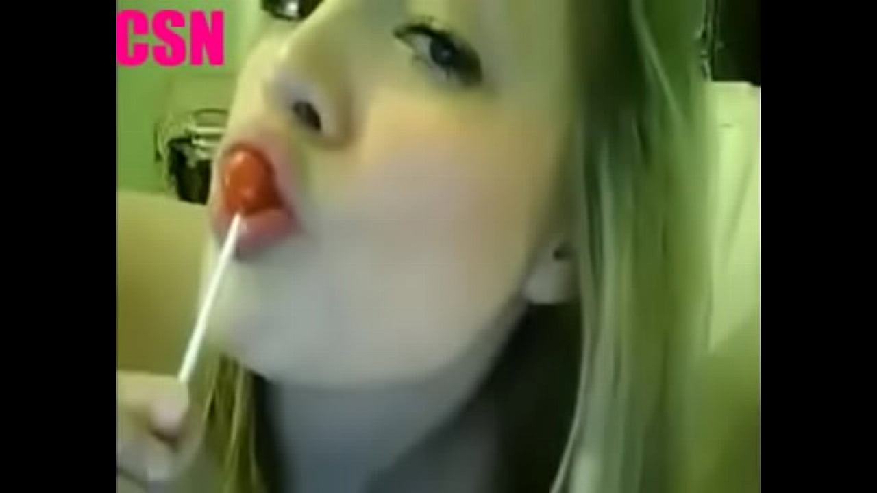 Blonde sucking lollipop