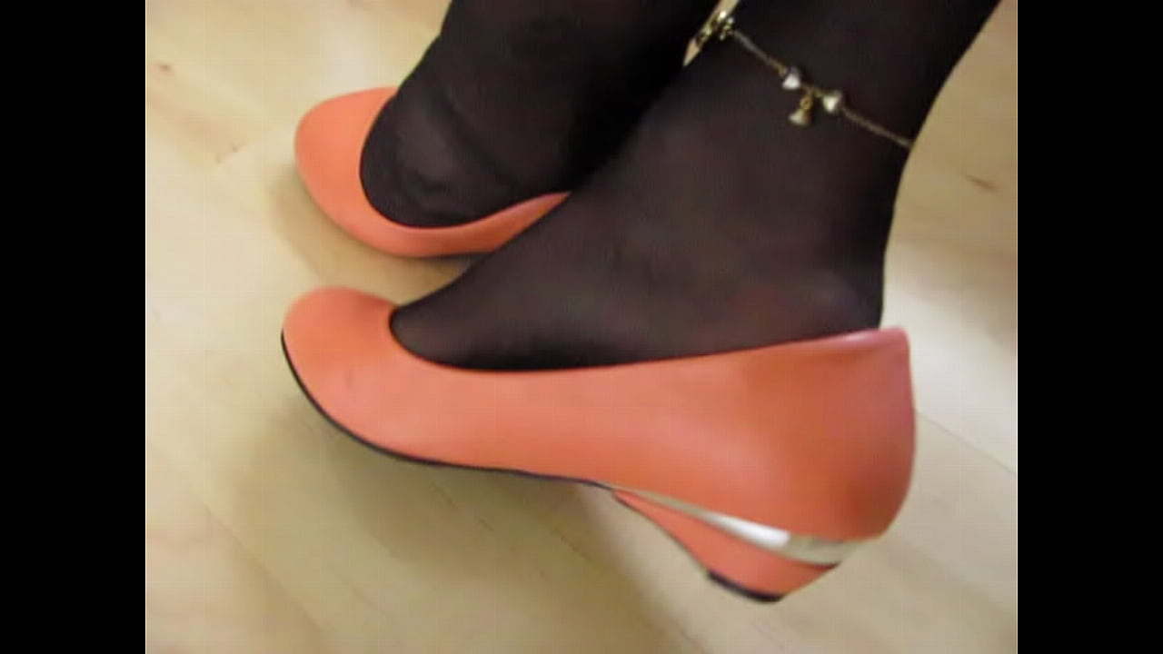 French Queen of shoeplay shows her red leather flats