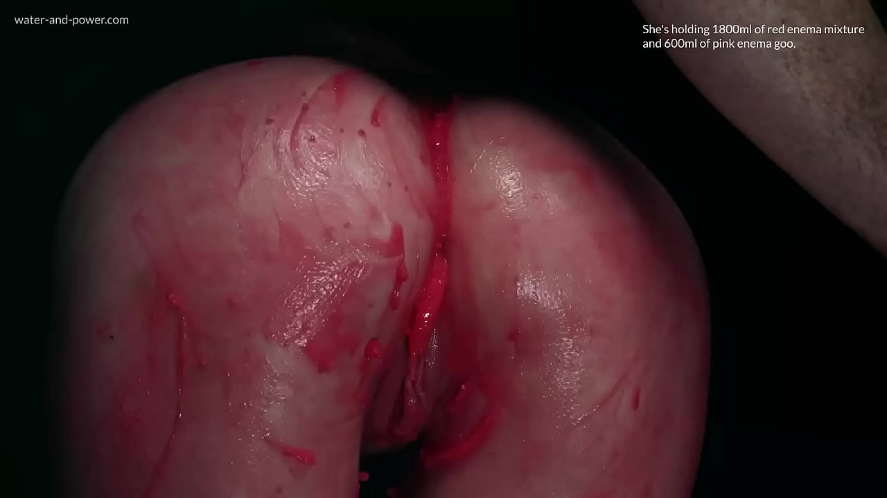 Violet Bee gets hooded and has her asshole injected with red enema mixture and pink enema goo