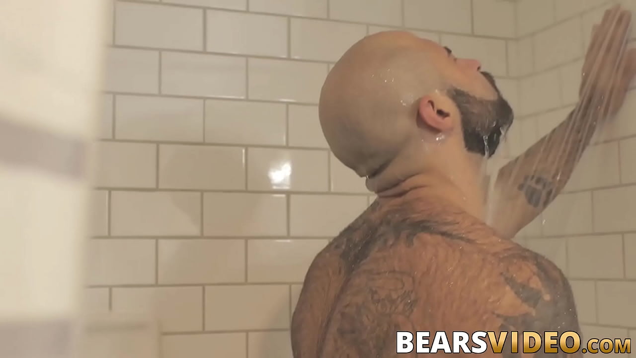 Hairy hunk jerks off solo in the shower