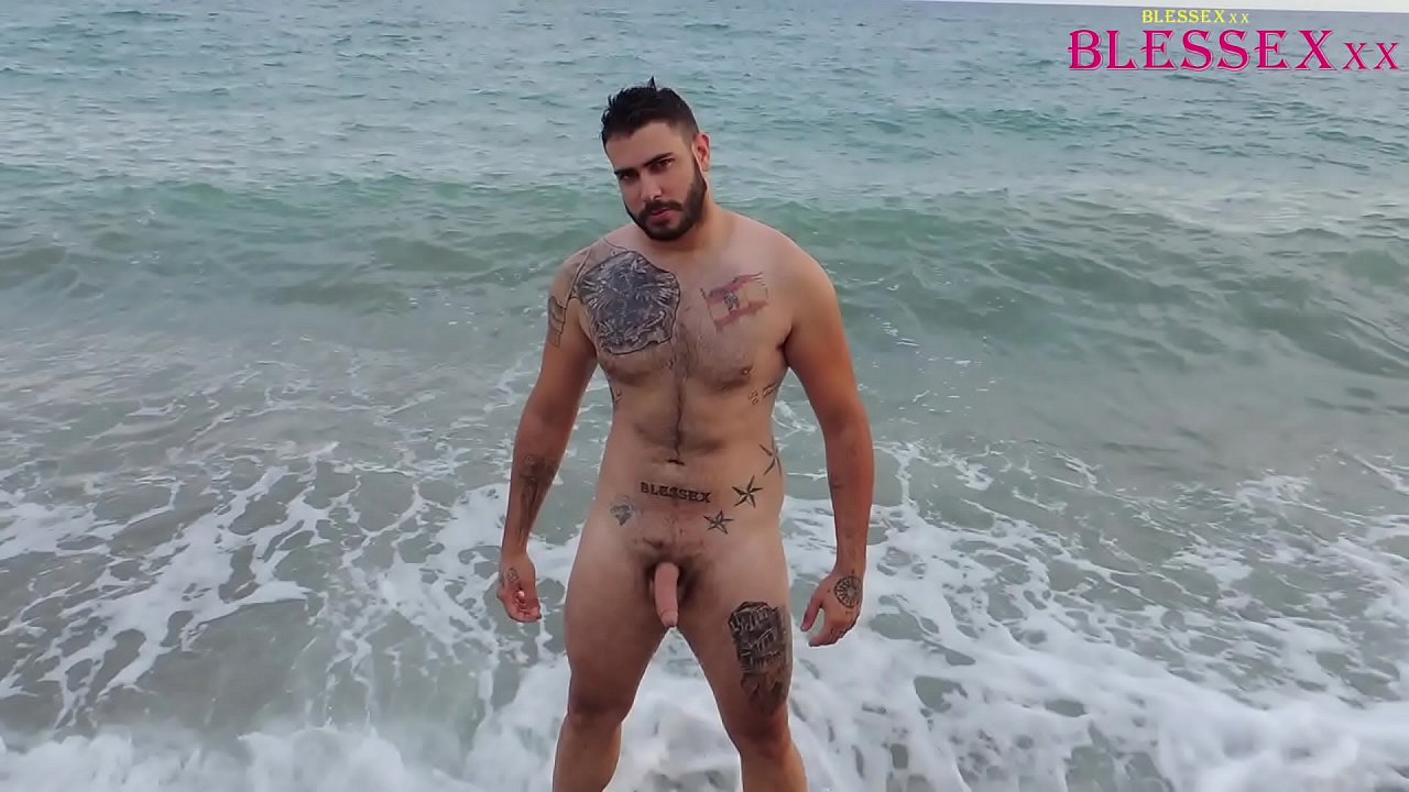 Straight male masturbating on a public beach