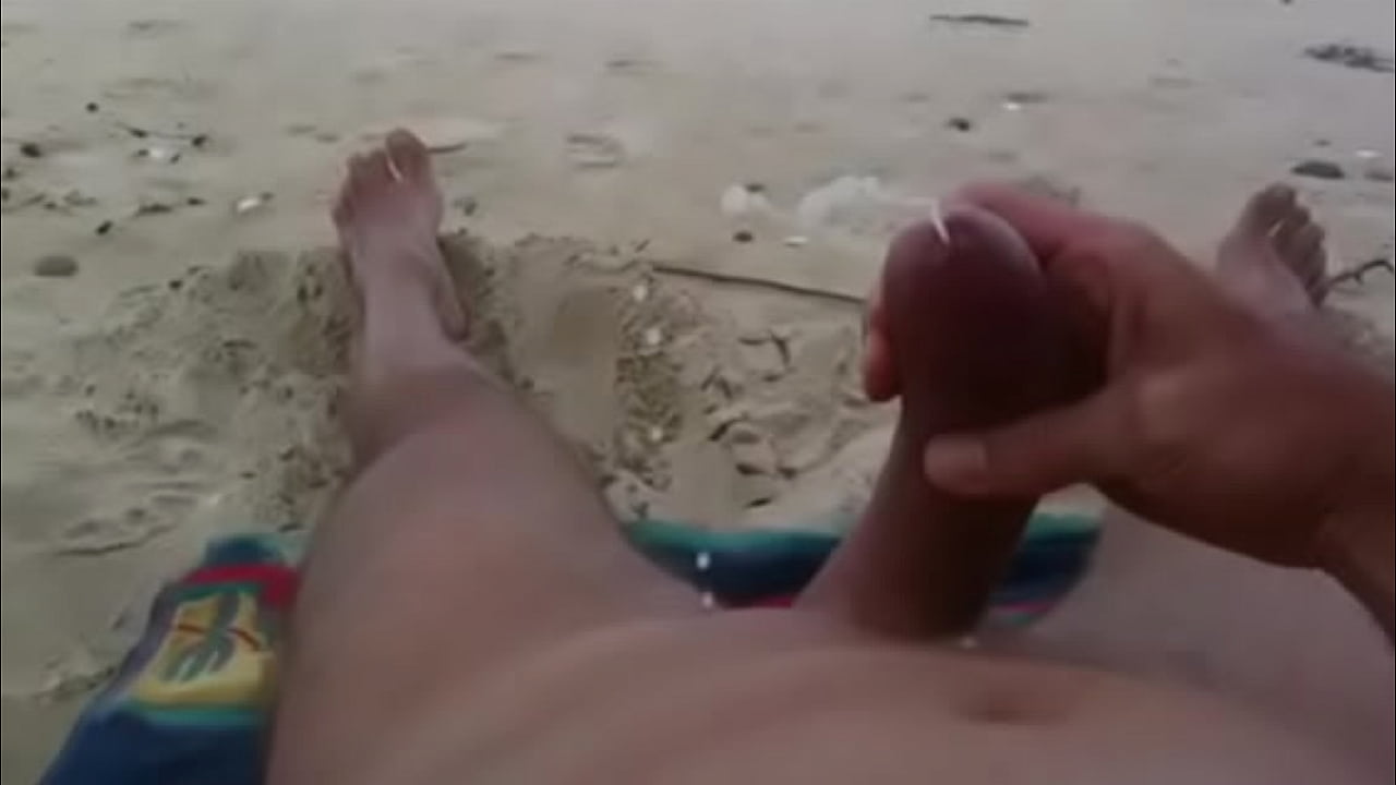 Curved cock wank and cum at nude beach