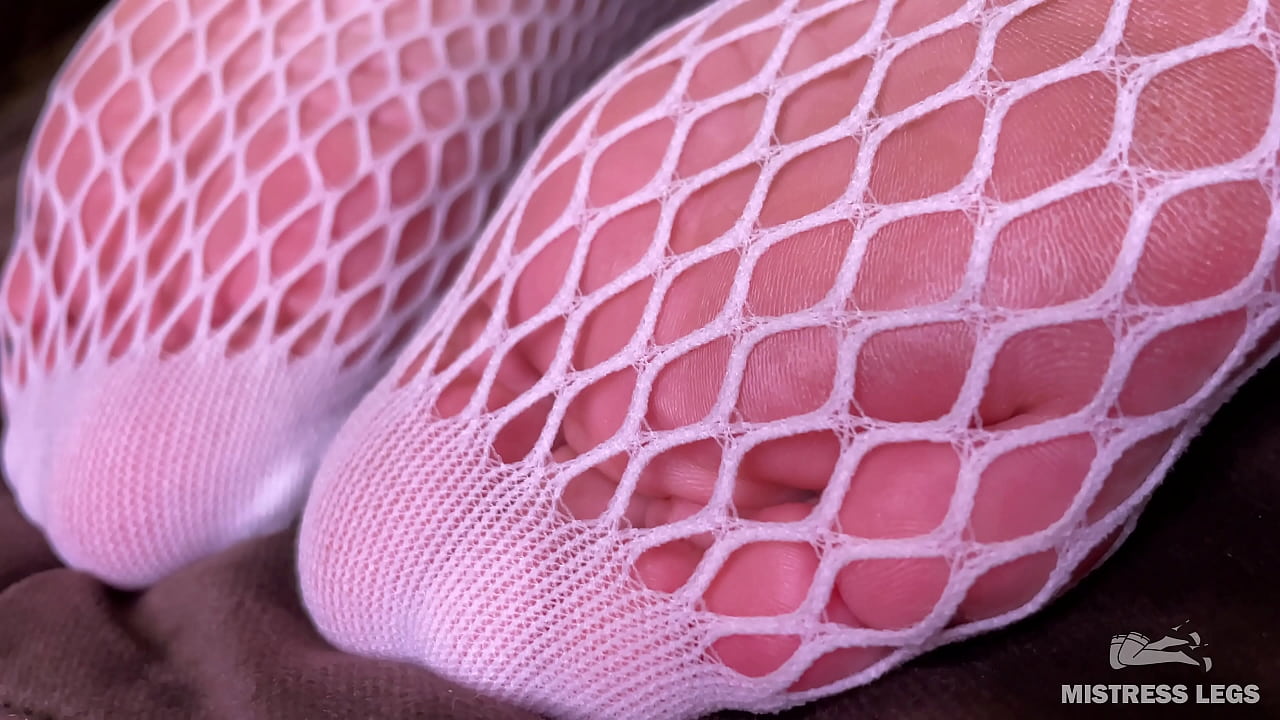 Sexy legs and feet in enticing fishnets tease you