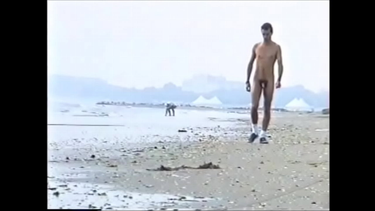 amatorial young boy walking naked on the beach