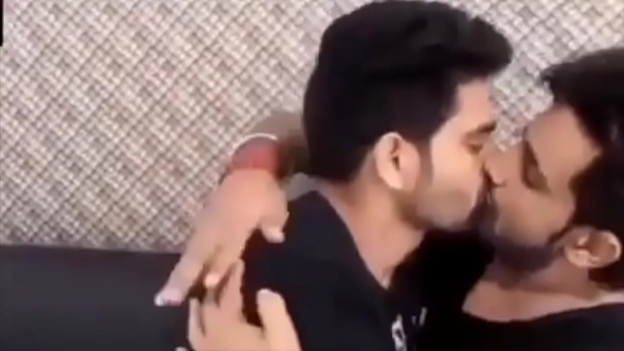 A couple of young boys from India kissing each other crazily