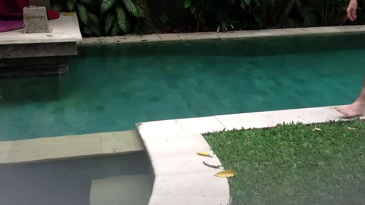 naked man by pool with soft cock