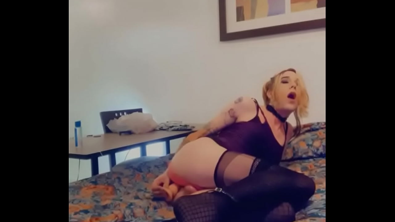 Slutty Shemale Fucking Her Ass in stockings and skirt