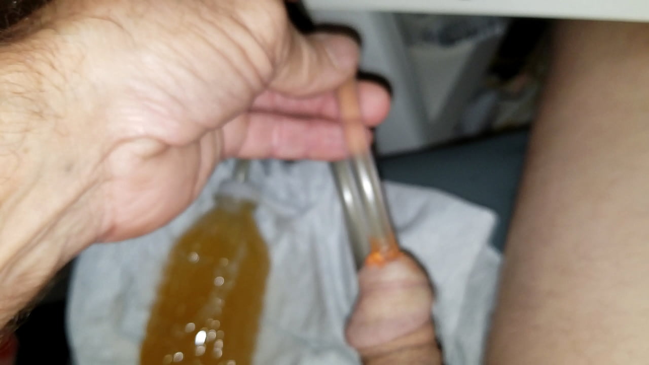 Orange Hose In Peehole Two Piss Bubbles