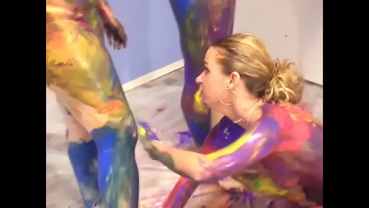 Four lesbian bitches hand paint their skin on the floor