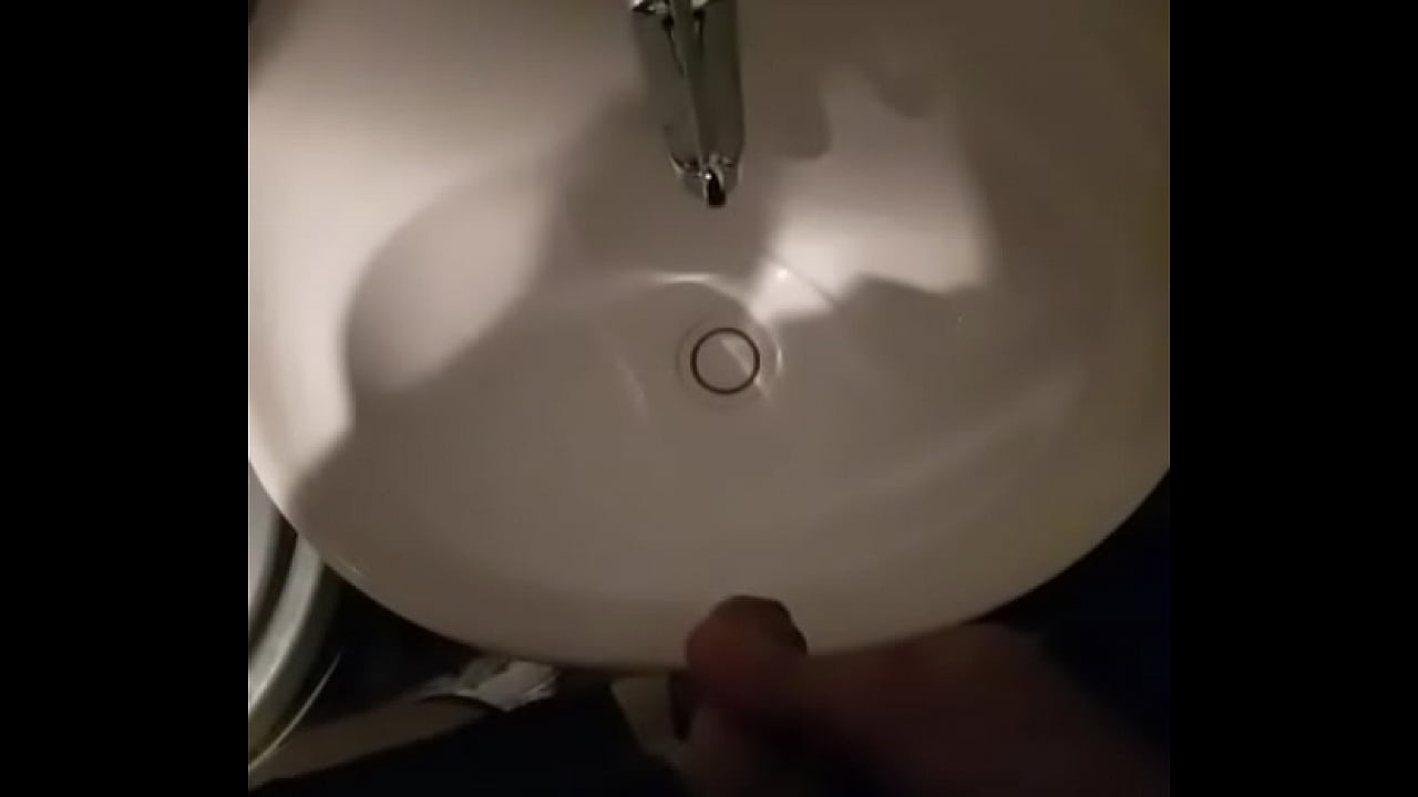 Man pissing in sink in restuarant