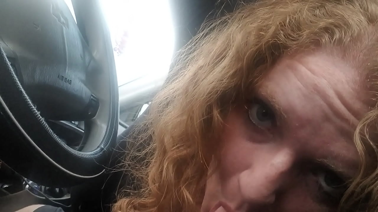 BBW Redhead sucks drivers cock while he drives in the middle of nowhere