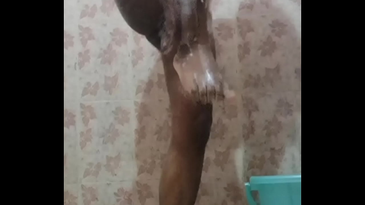 Nude bathing boy in bathroom