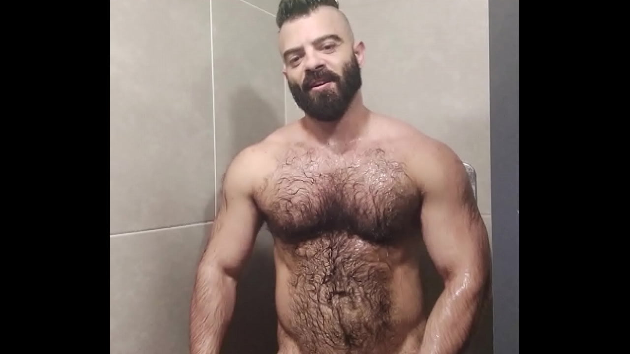 Furry sweat bear taking a shower after training.