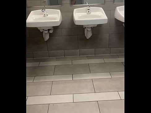 Jerking off completely nude in a public bathroom and cumming on the floor