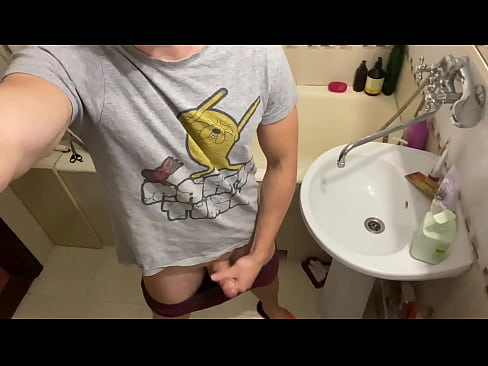 Guy jerking off cock in the bathroom