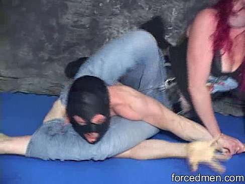 Red headed mistress beats a masked man in a mixed wrestling