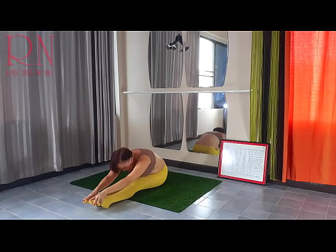 Regina Noir. Yoga in yellow tights doing yoga in the gym. 4