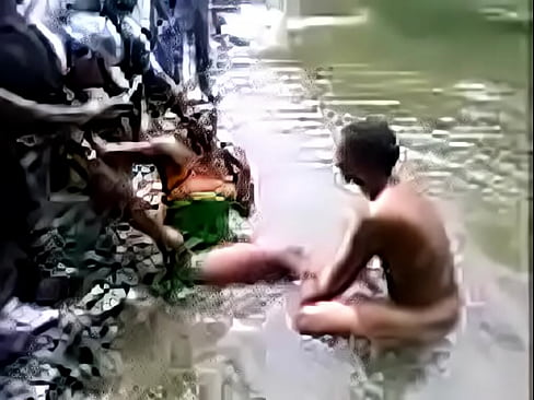 Indian people bathing in a river
