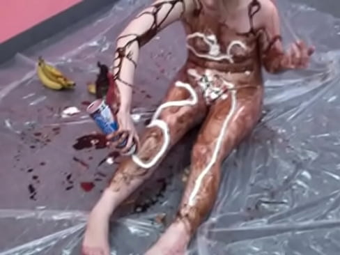 Cute Veronica Snow rubs chocolate syrup all over her sexy body