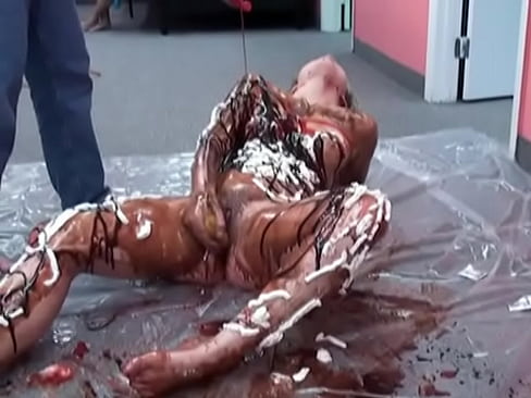 Cute Veronica Snow rubs chocolate syrup all over her sexy body