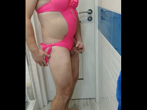 Tranny in pink swimsuit monokini bikini
