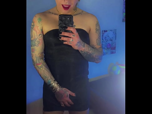 Trans girl Emma Ink shows off in the mirror in high heels and a short dress. Without panties his big dick was loose