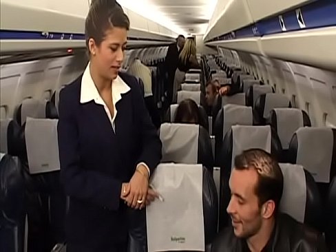Sexy flight attendant Alyson Ray takes  passenger's hard cock in her perfect ass swallows a lot of his cum after the flight