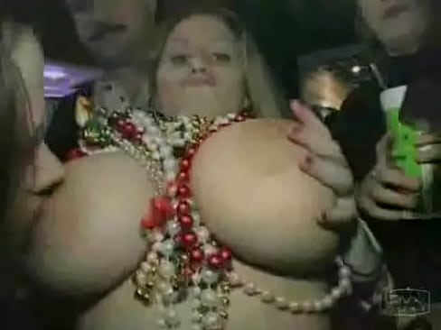 Busty girl shows boobs at Mardi Gras