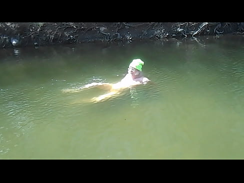 Skinnydipping Naked Driver gets out of the water